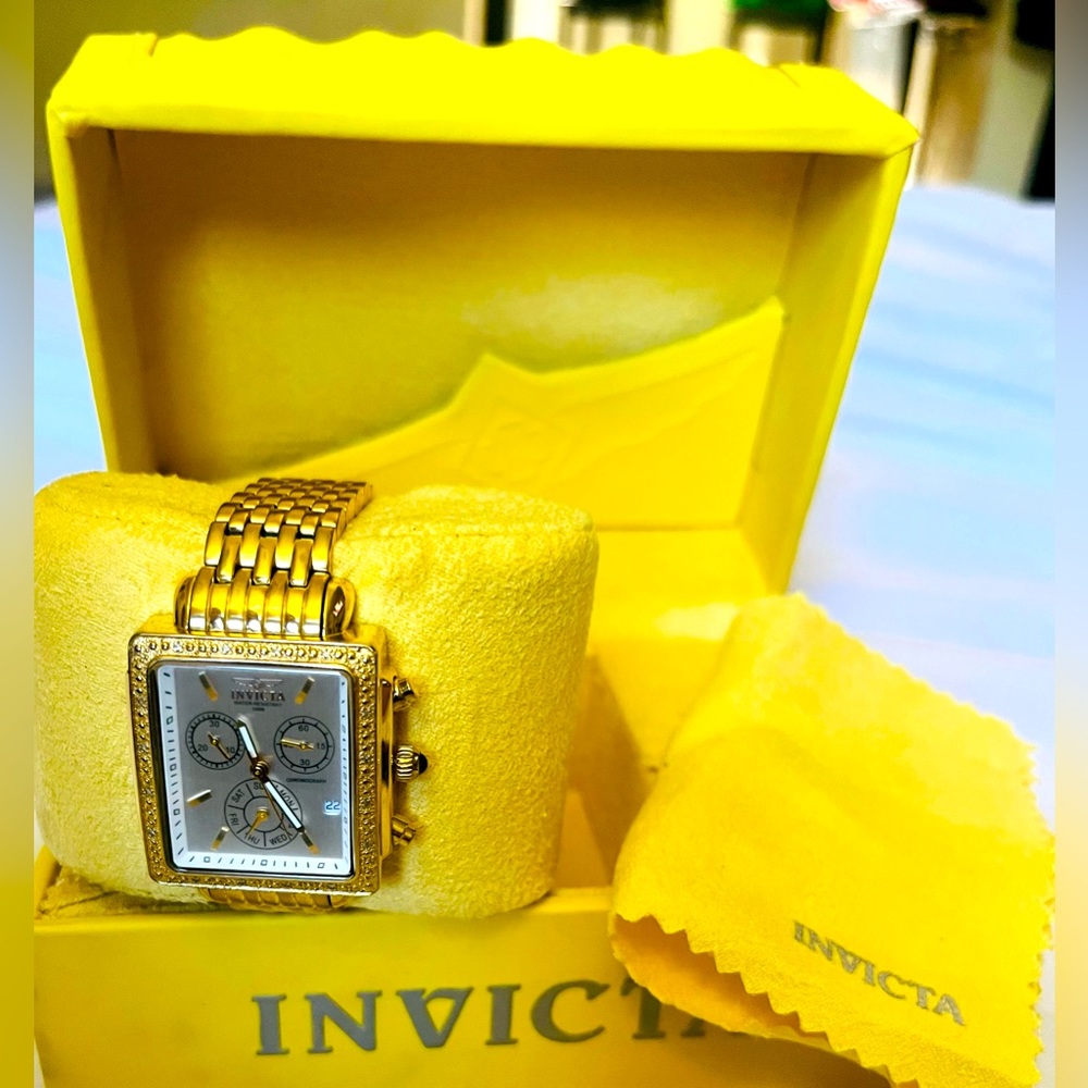 16mm Gold Tone Stainless Steel Invicta Watch. 16 Bezel diamonds. Model # 5375.